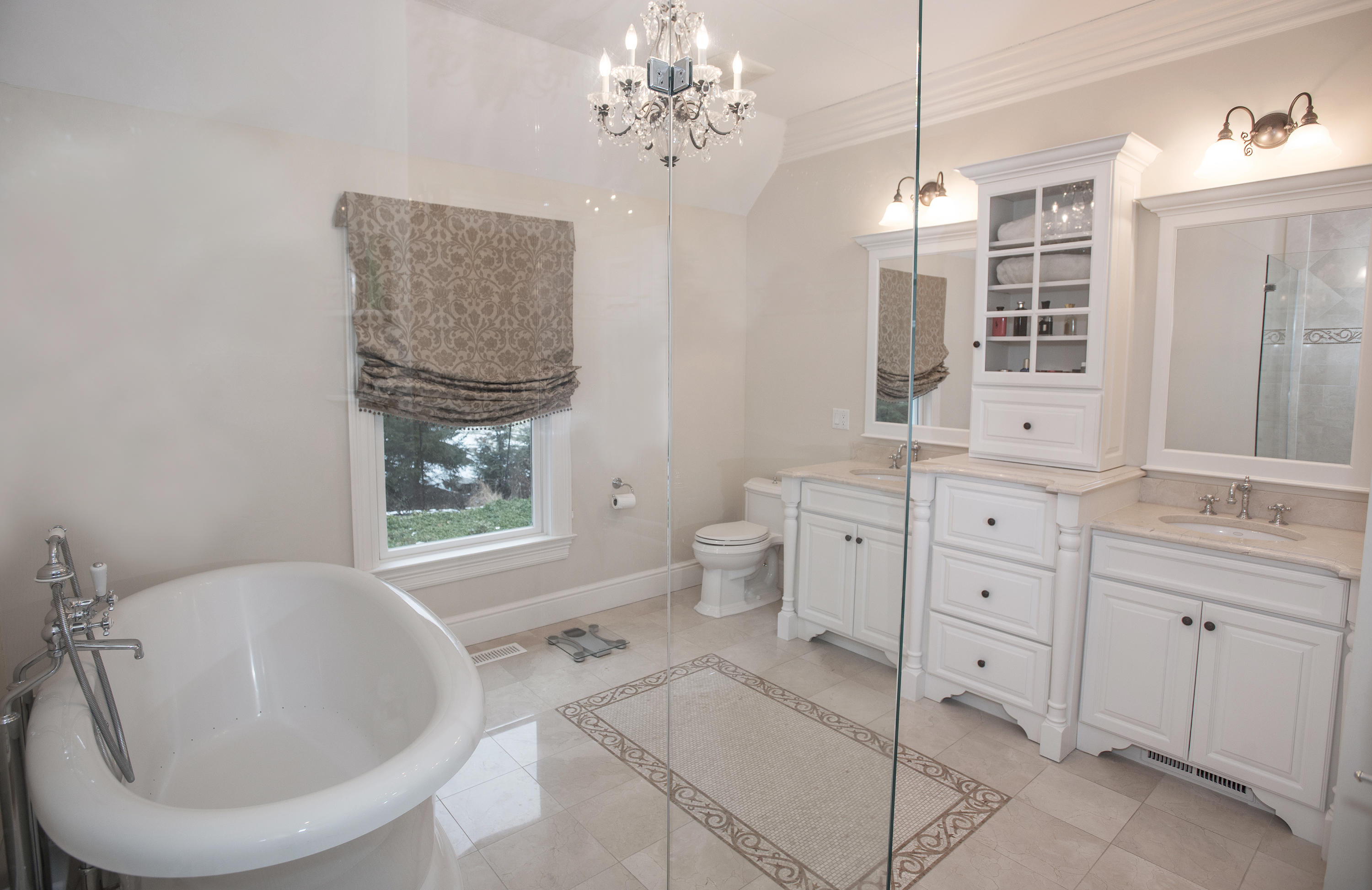 130 Skyview Lane New Canaan, CT 06840 - Photo 29 of 44 a spacious bathroom with double vanity sink a mirror a bathtub and a window