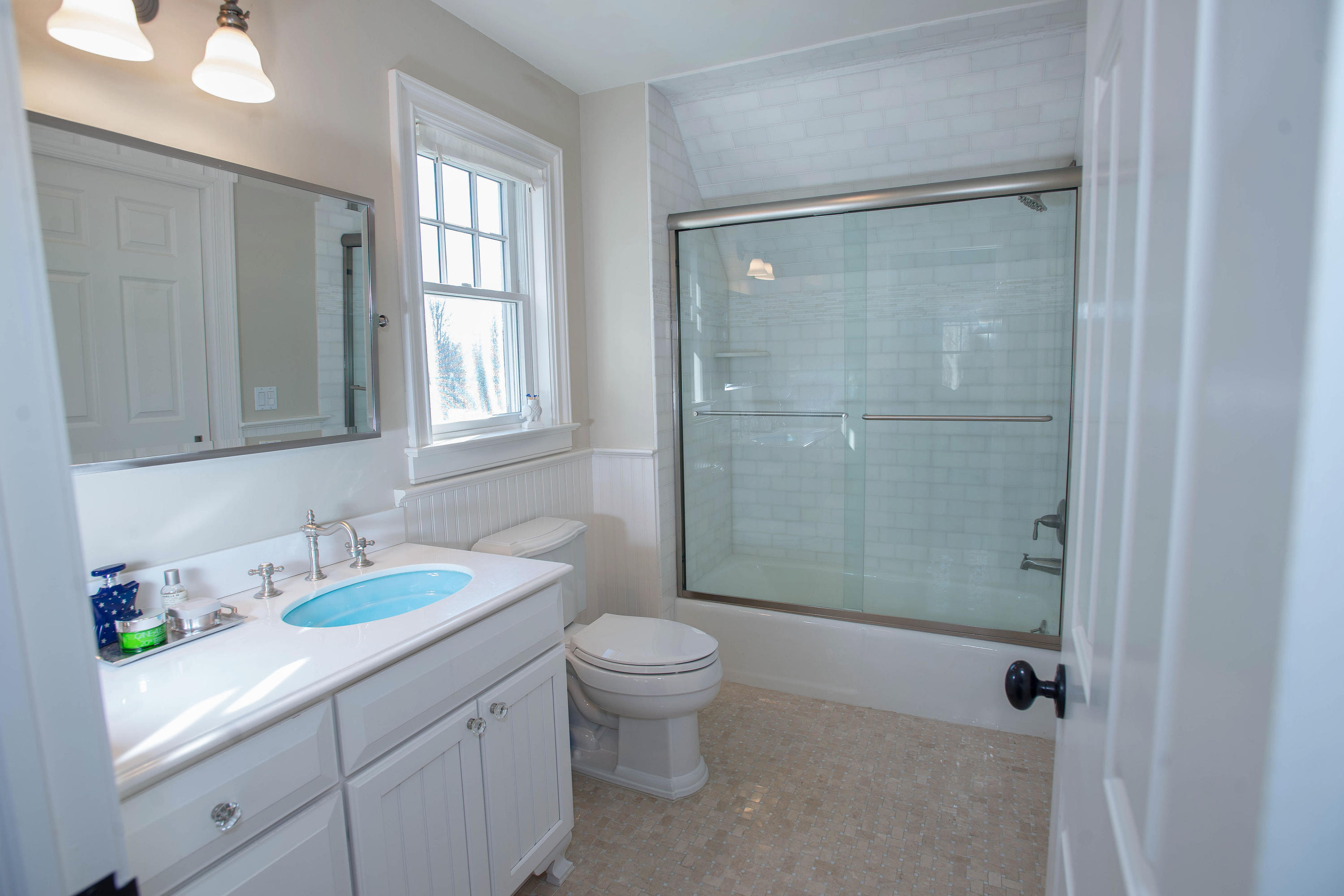 130 Skyview Lane New Canaan, CT 06840 - Photo 38 of 44 a bathroom with a granite countertop sink a toilet and shower