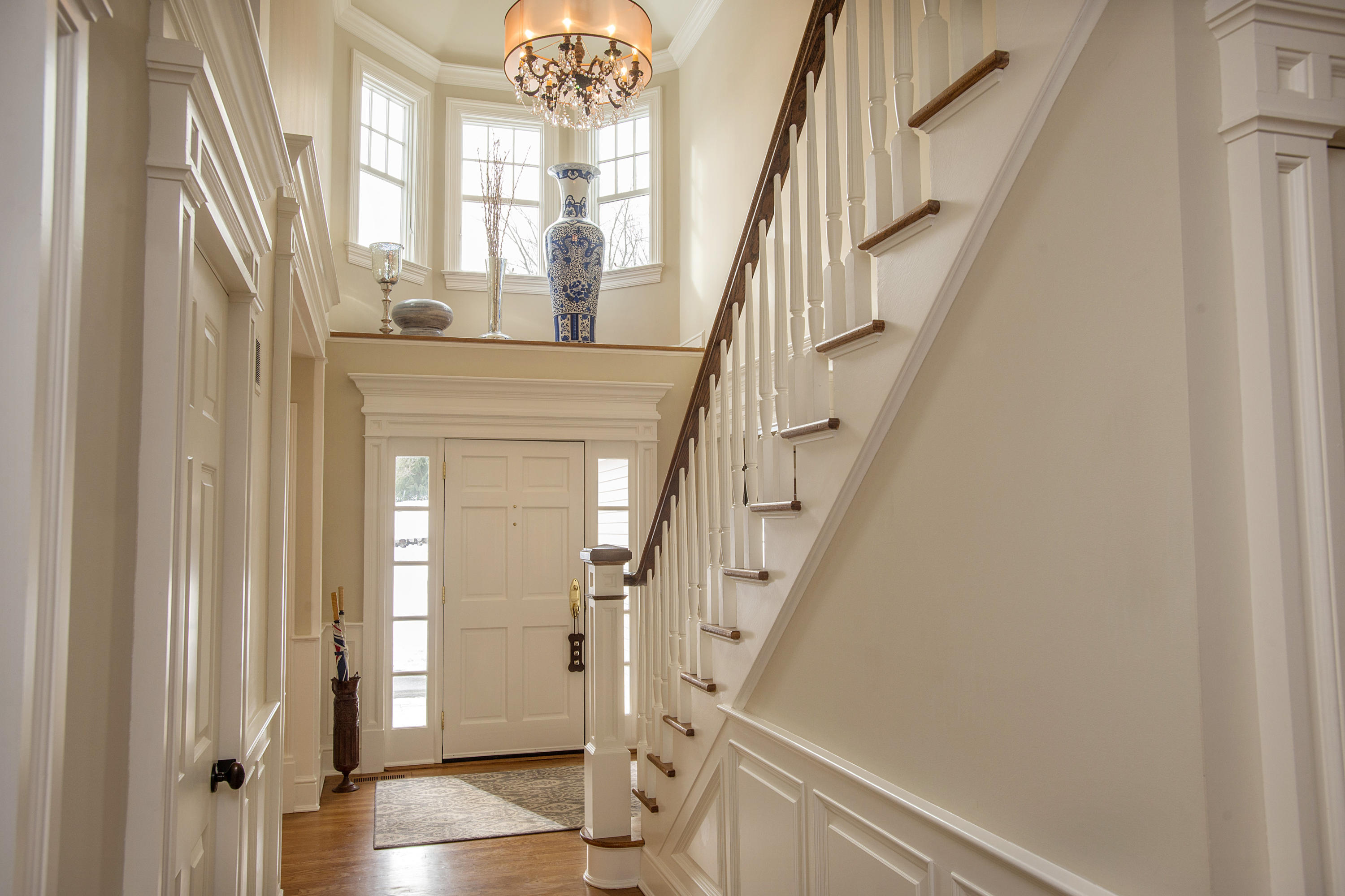 130 Skyview Lane New Canaan, CT 06840 - Photo 6 of 44 a view of entryway with wooden floor and stair