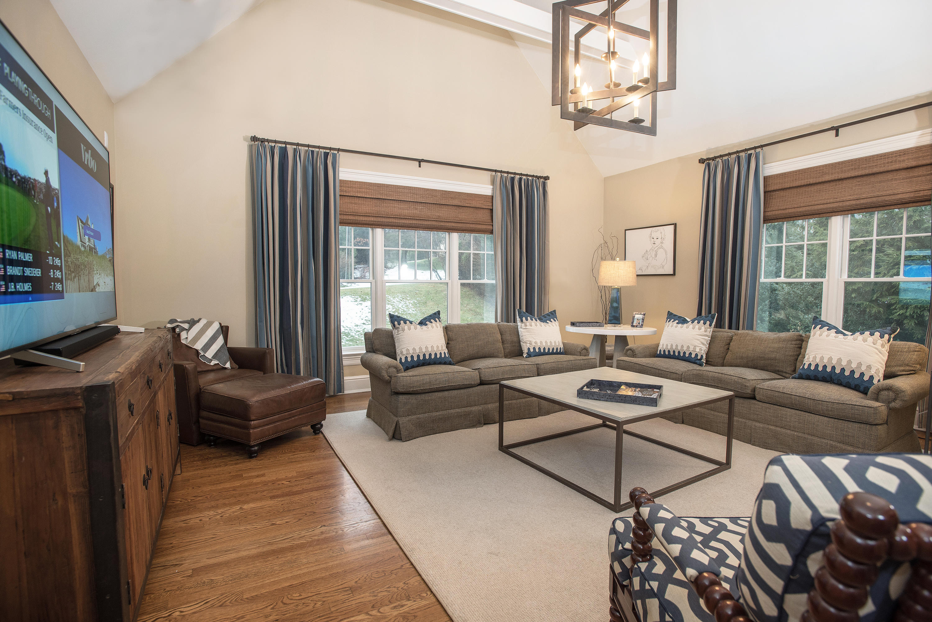 130 Skyview Lane New Canaan, CT 06840 - Photo 7 of 44 a living room with furniture a chandelier and a window