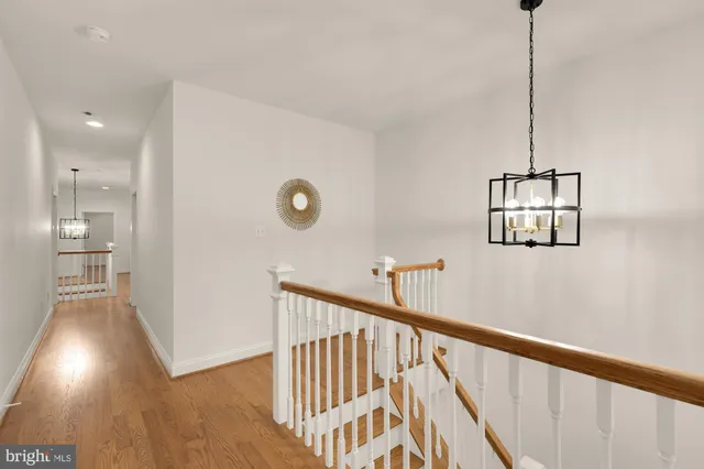 a bathroom with a granite countertop sink a large mirror and a bathtub