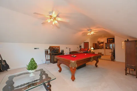 a bedroom with furniture and a chandelier