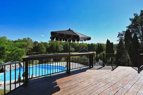a view of a swimming pool with a patio