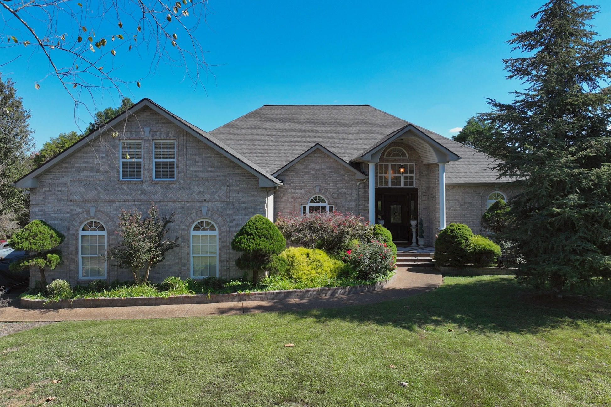 222 Ridgewater Way Mount Juliet, TN 37122 - Photo 3 of 41 a front view of a house with a yard and garage