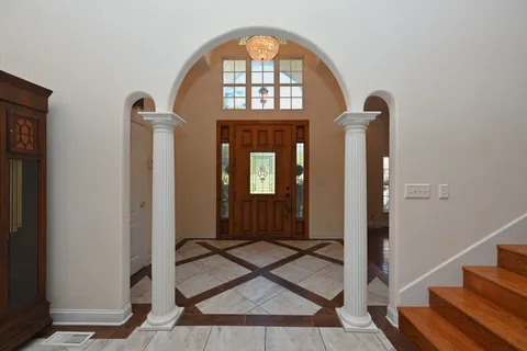 a view of an entryway with a front door