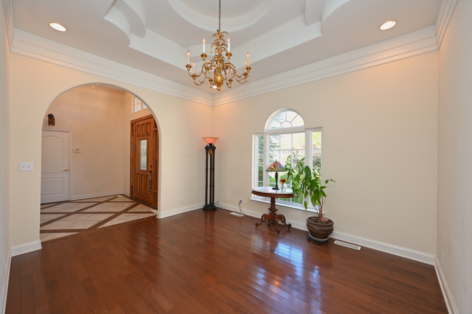 222 Ridgewater Way Mount Juliet, TN 37122 - Photo 5 of 41 an empty room with wooden floor chandelier and windows