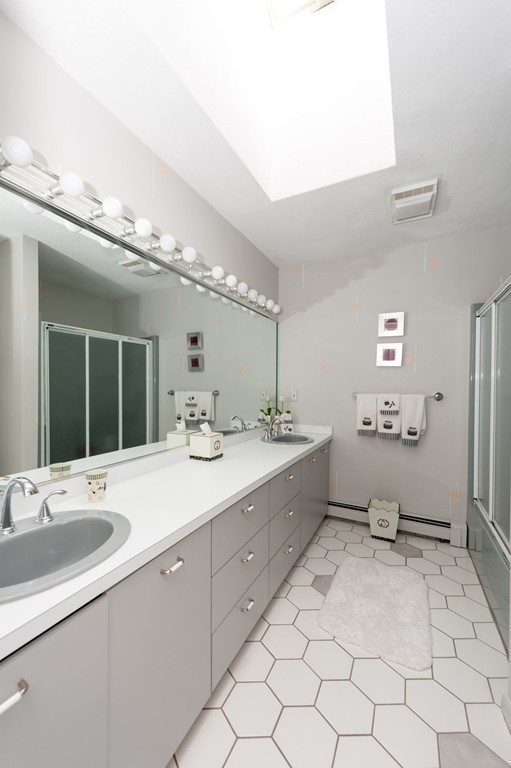 42 Magnolia Road Sharon, MA 02067 - Photo 11 of 24 a spacious bathroom with a sink mirror and toilet