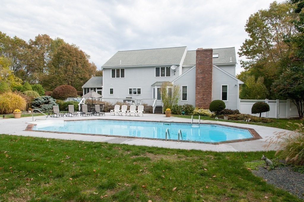 42 Magnolia Road Sharon, MA 02067 - Photo 20 of 24 a view of a house with a yard and sitting area