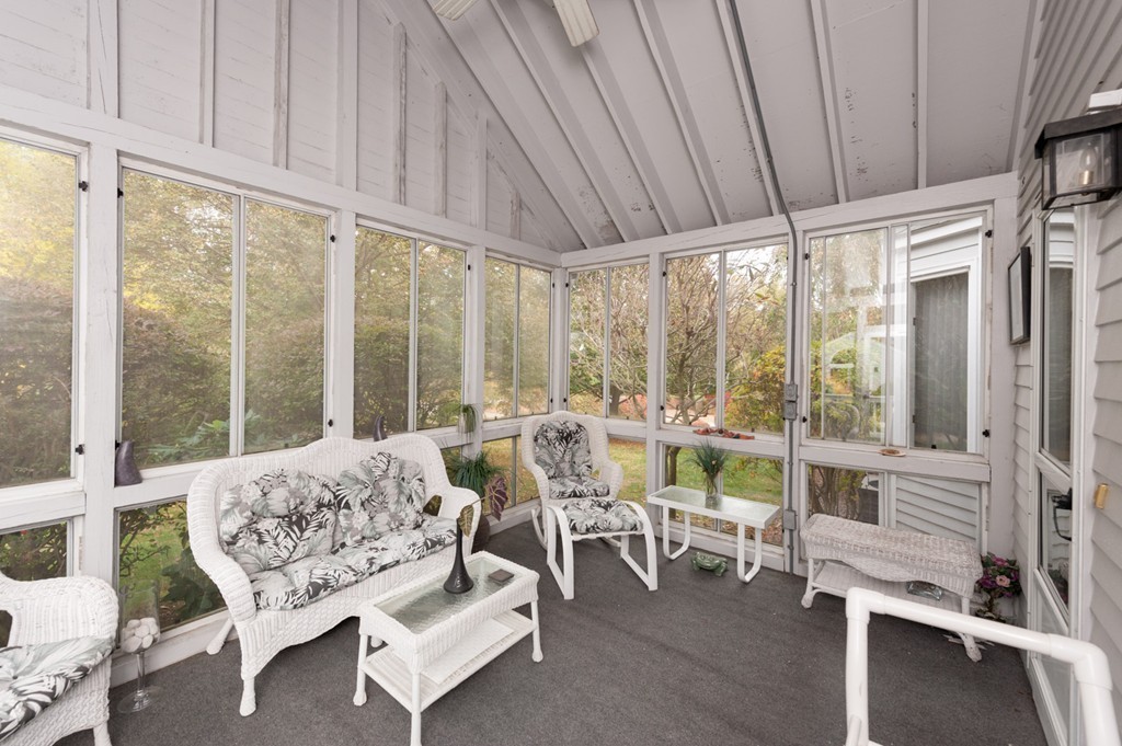 42 Magnolia Road Sharon, MA 02067 - Photo 24 of 24 a living room with furniture a large window and a table