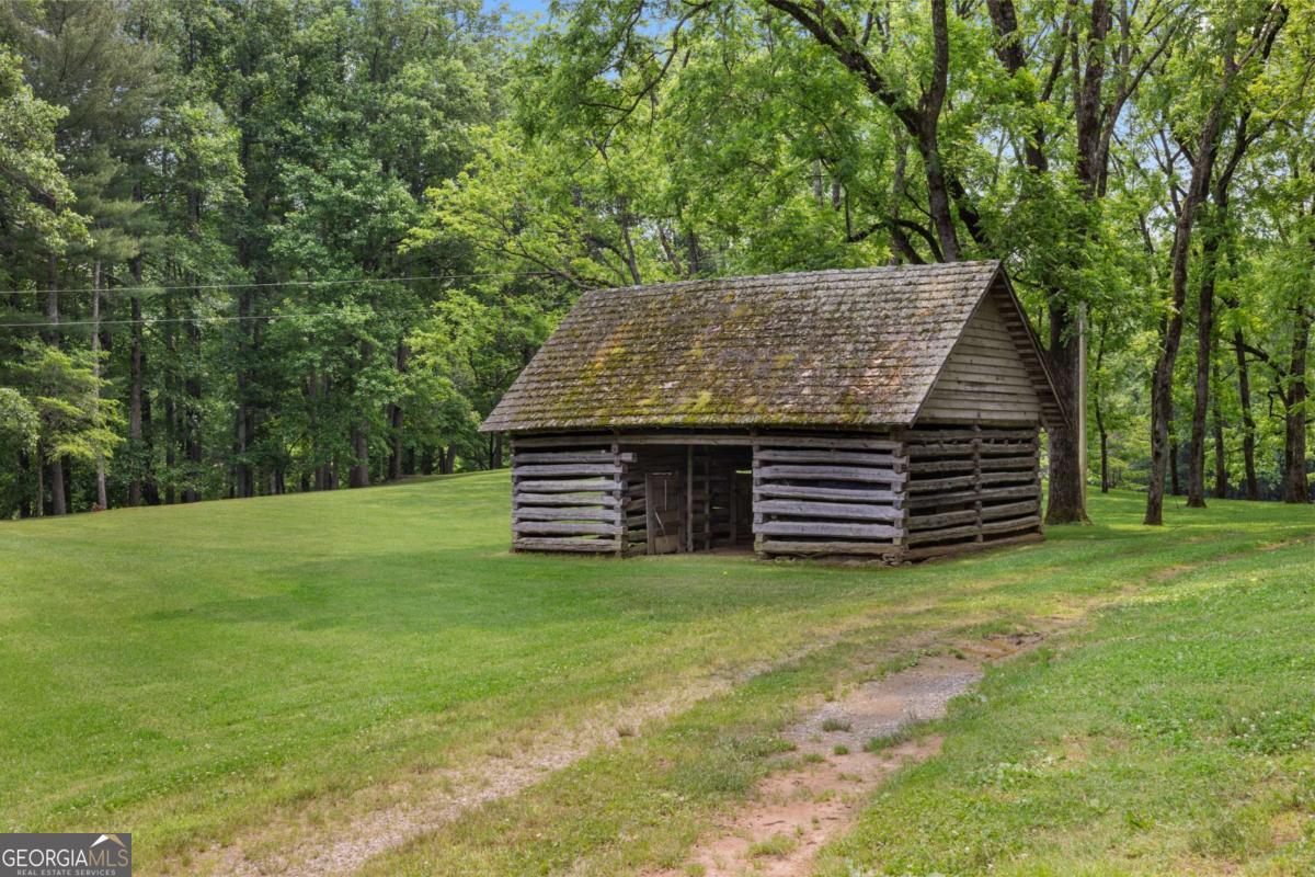 7320 Chestnut Valley Road Hiawassee, GA 30546 - Photo 17 of 91 a view of a house with a backyard
