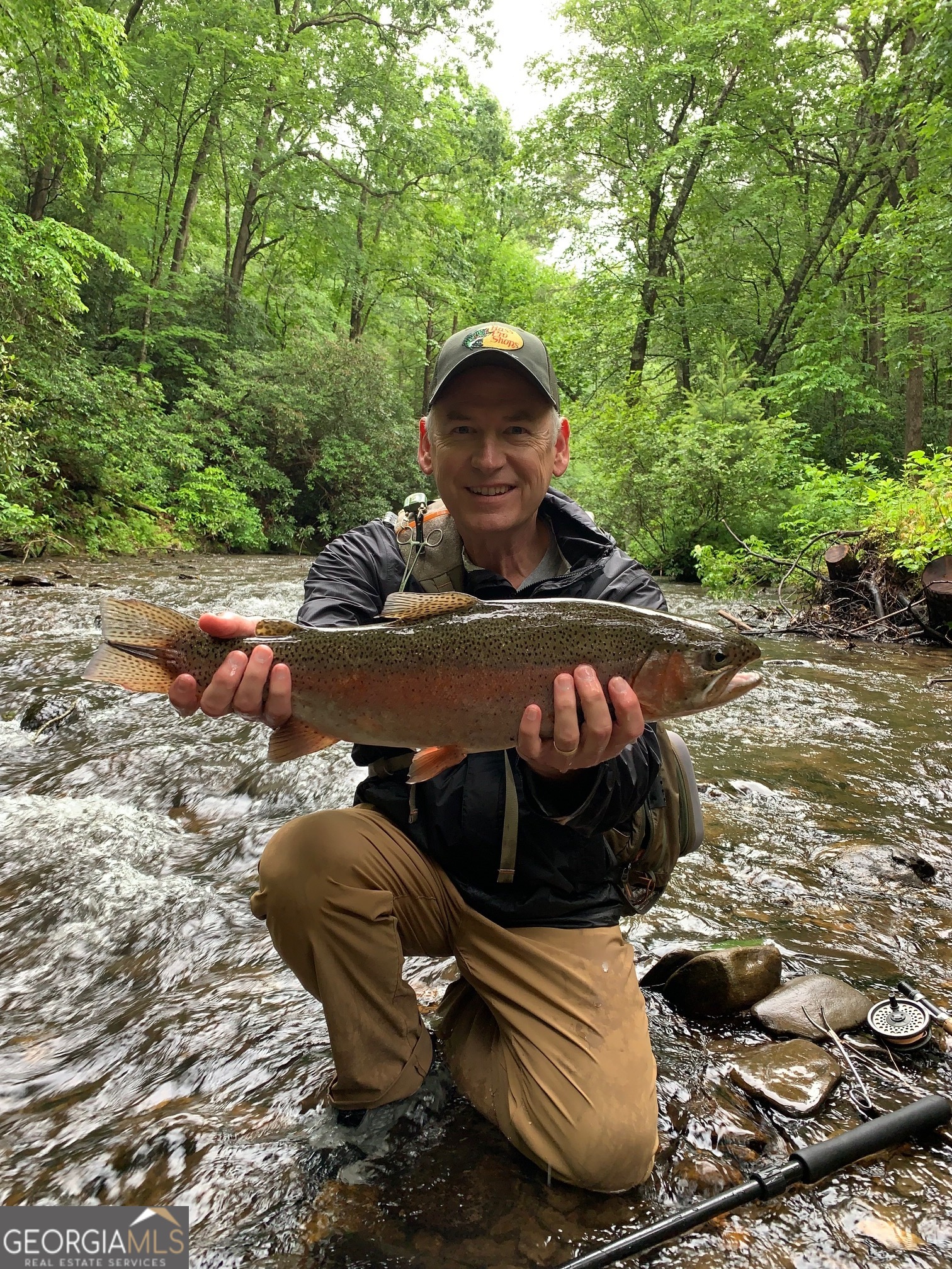 7320 Chestnut Valley Road Hiawassee, GA 30546 - Photo 35 of 91 a view of a backyard with table and chairs and a stove