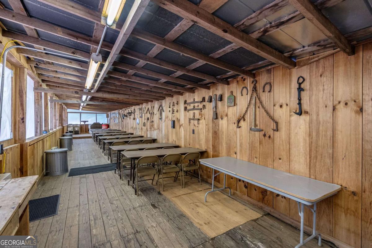 7320 Chestnut Valley Road Hiawassee, GA 30546 - Photo 55 of 91 a roof deck with table and chairs with wooden floor