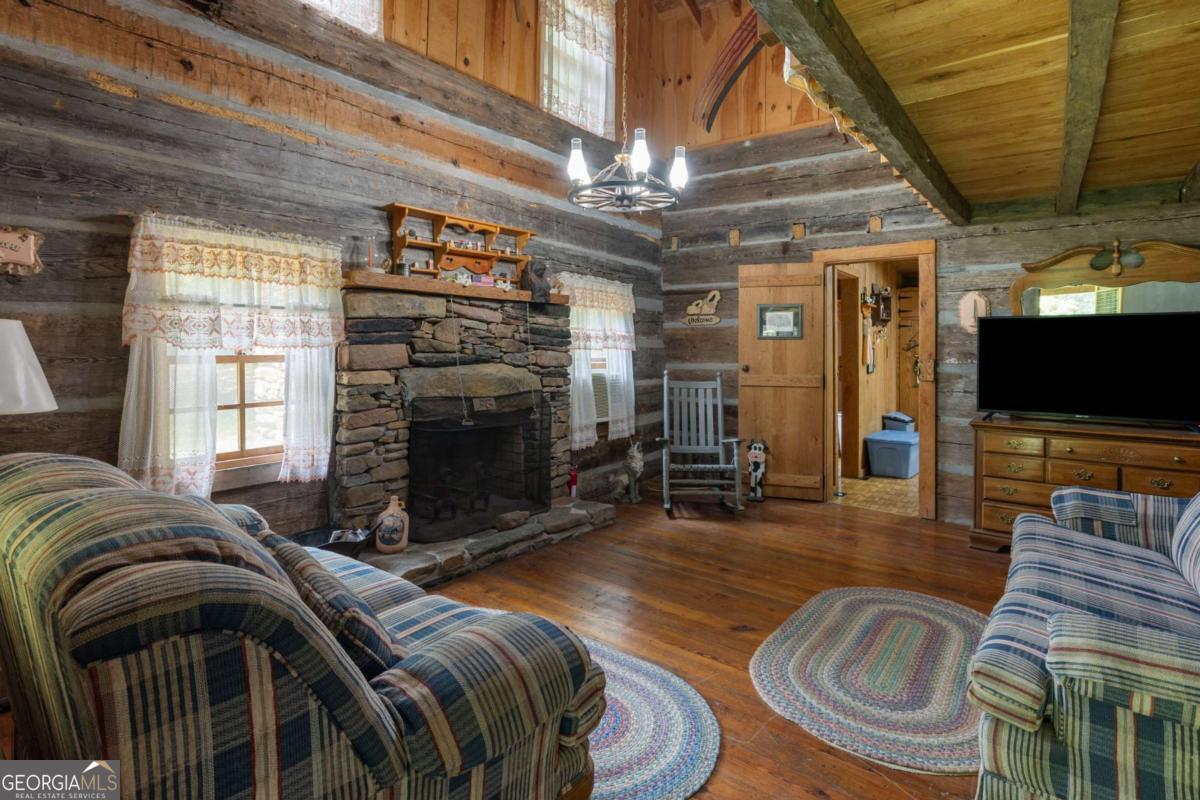 7320 Chestnut Valley Road Hiawassee, GA 30546 - Photo 67 of 91 a view of a livingroom with furniture and a fireplace