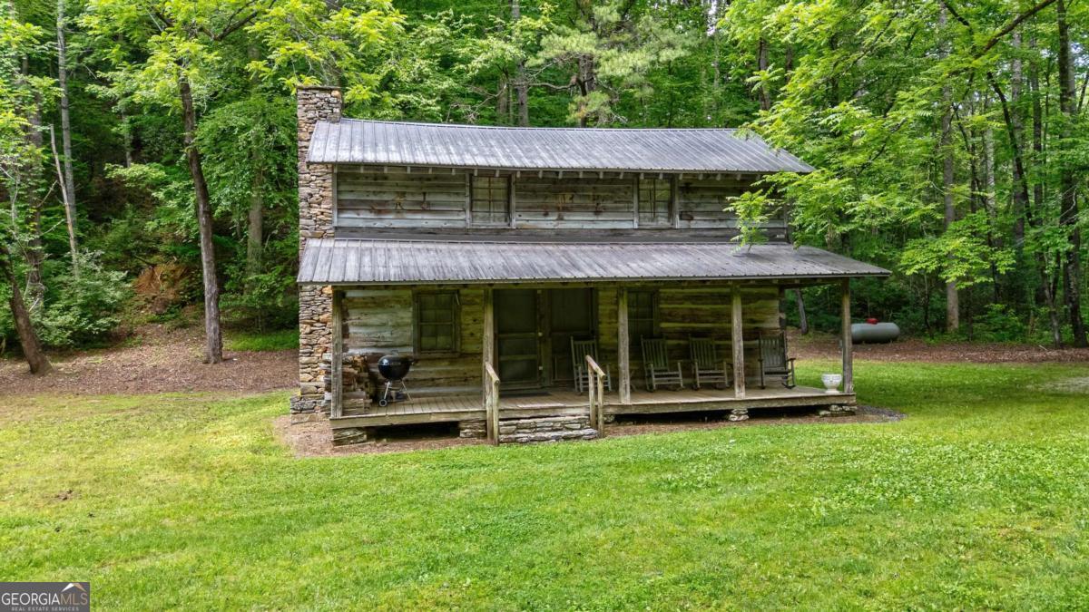 7320 Chestnut Valley Road Hiawassee, GA 30546 - Photo 72 of 91 a view of a house with backyard porch and sitting area