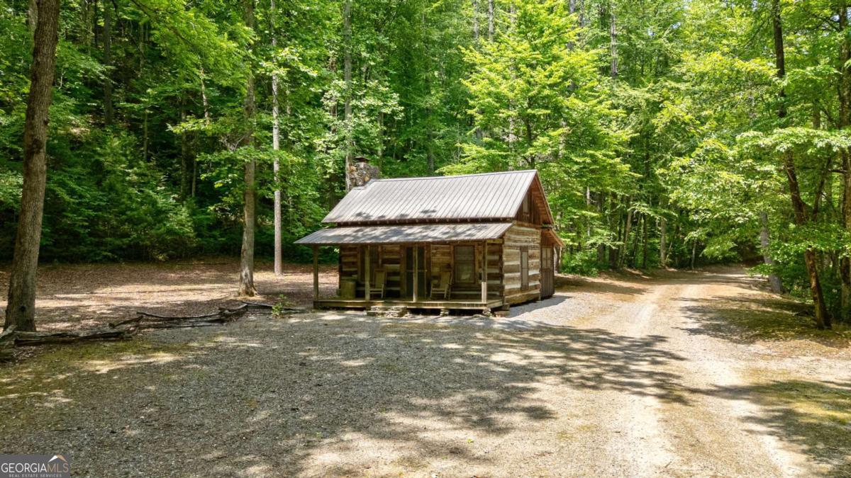 7320 Chestnut Valley Road Hiawassee, GA 30546 - Photo 74 of 91 a backyard of a house with yard barbeque oven and outdoor seating