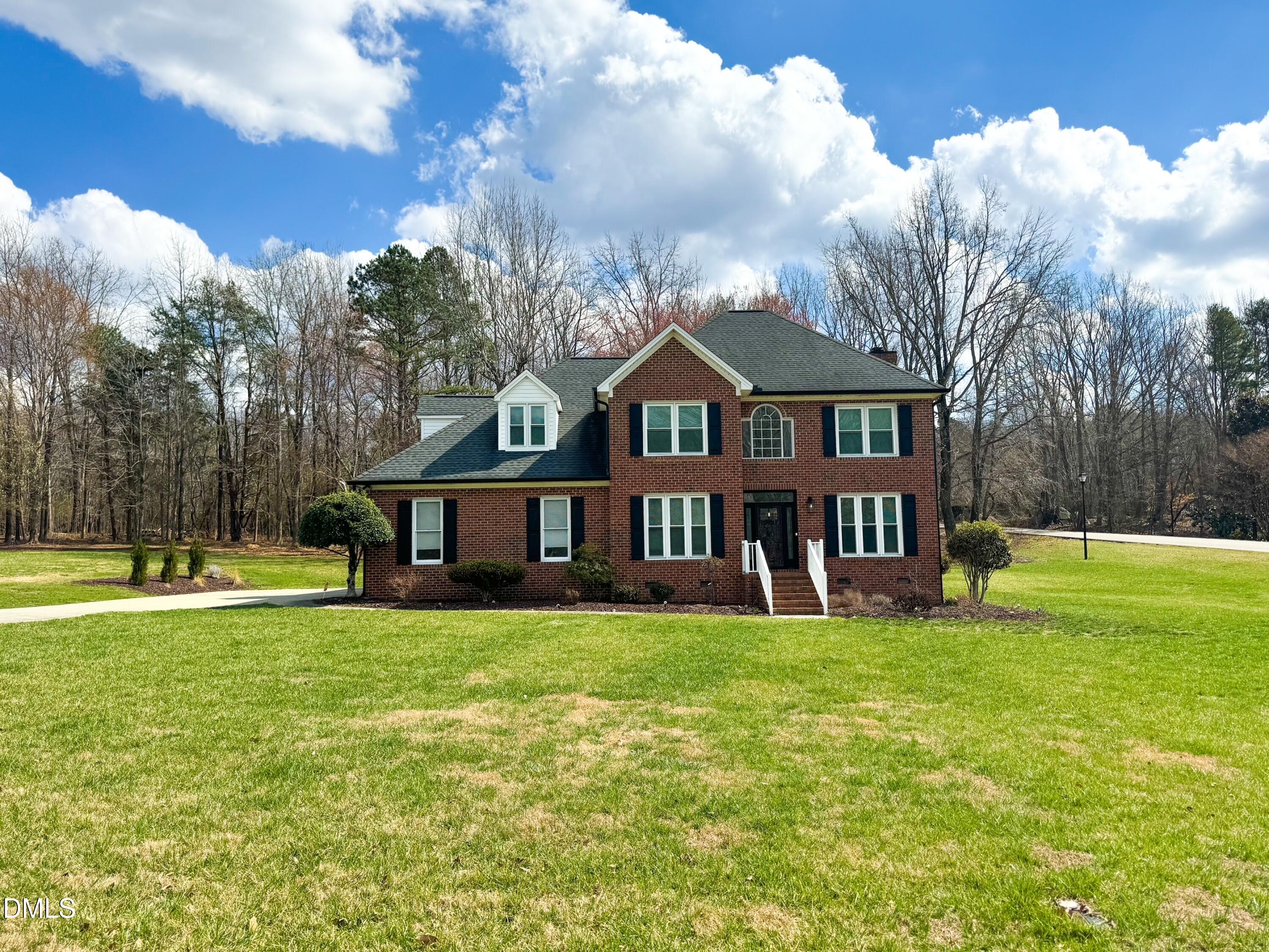 120 Denada Path Roxboro, NC 27574 - Photo 2 of 43 a view of a house with a big yard and large trees
