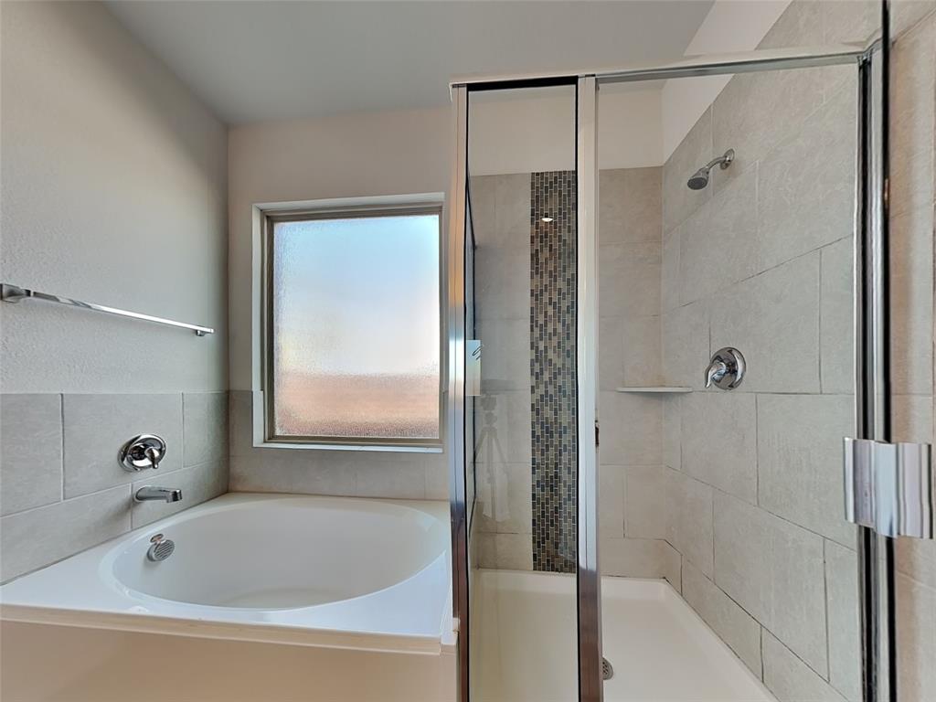 506 Robinson Way Fate, TX 75189 - Photo 12 of 30 Bathroom with a garden tub and a shower stall