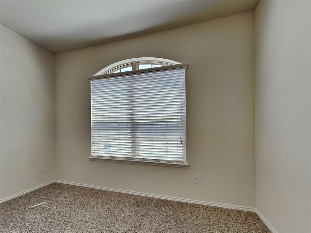 506 Robinson Way Fate, TX 75189 - Photo 13 of 30 Carpeted empty room featuring baseboards