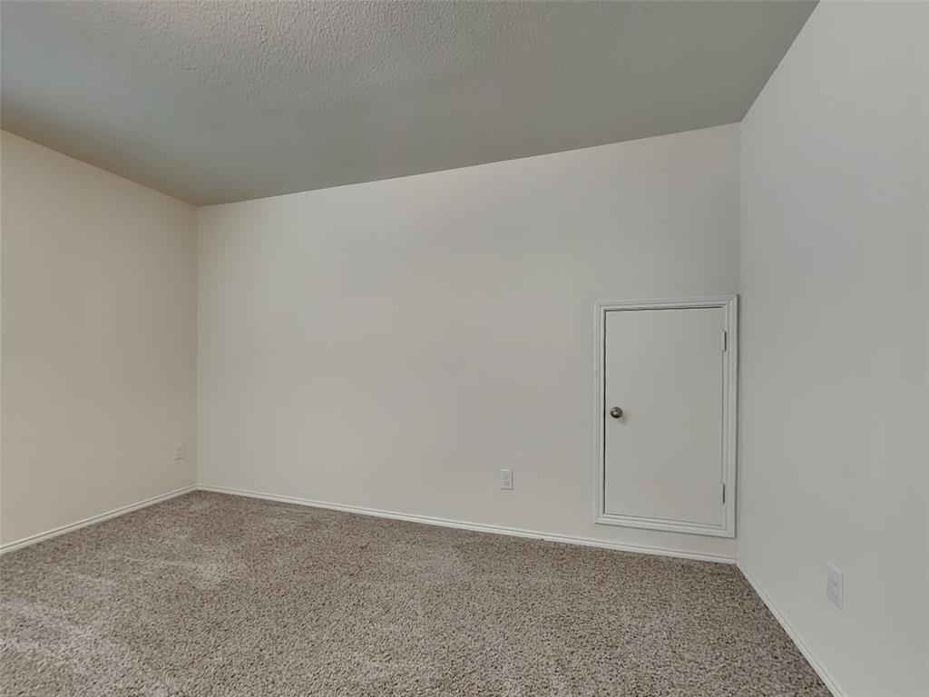 506 Robinson Way Fate, TX 75189 - Photo 20 of 30 Carpeted empty room featuring baseboards and a textured ceiling