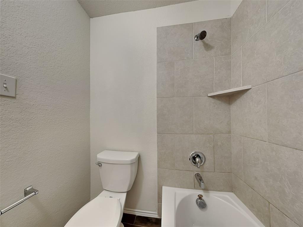 506 Robinson Way Fate, TX 75189 - Photo 26 of 30 Full bath featuring shower / washtub combination and a textured wall