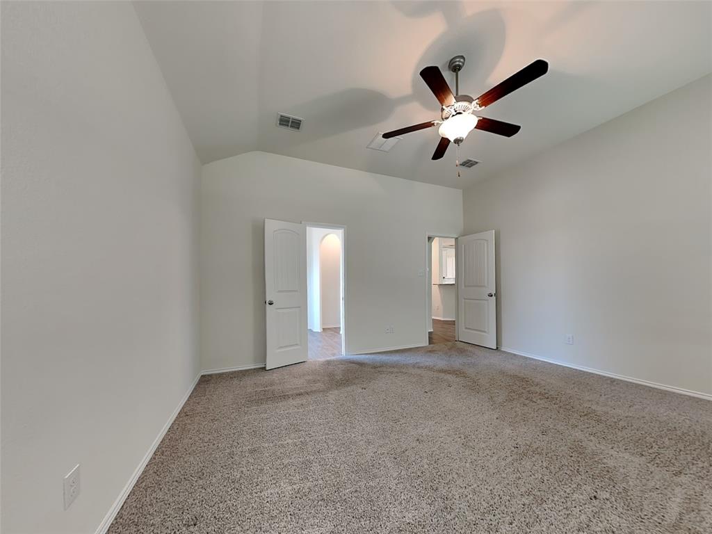 506 Robinson Way Fate, TX 75189 - Photo 9 of 30 Unfurnished bedroom featuring carpet floors, lofted ceiling, and ceiling fan
