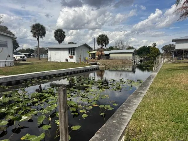 a view of a patio with wooden floor