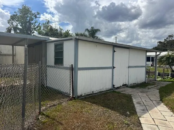 a backyard of a house with a yard and garage