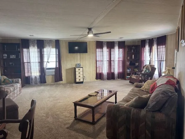a living room with furniture window and gym equipment