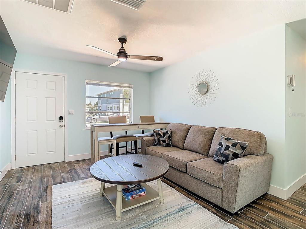 4984 Cedarbrook Lane Hernando Beach, FL 34607 - Photo 13 of 61 a living room with furniture and a window