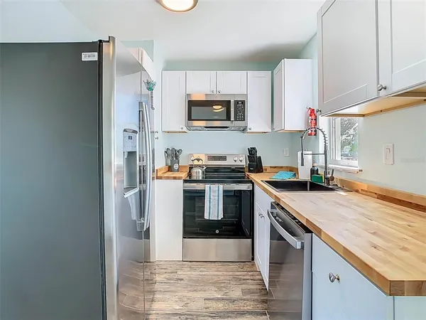 a spacious bathroom with a sink and a mirror