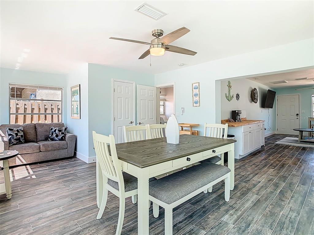 4984 Cedarbrook Lane Hernando Beach, FL 34607 - Photo 25 of 61 a living room with furniture and wooden floor