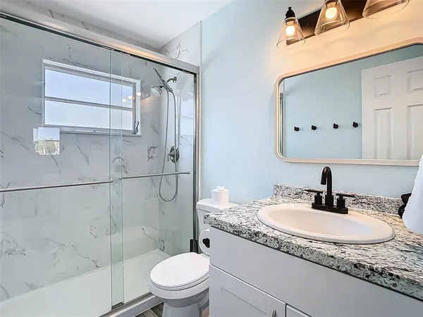 a bathroom with a sink and a window