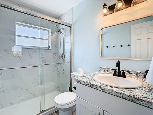 a bathroom with a sink and a window