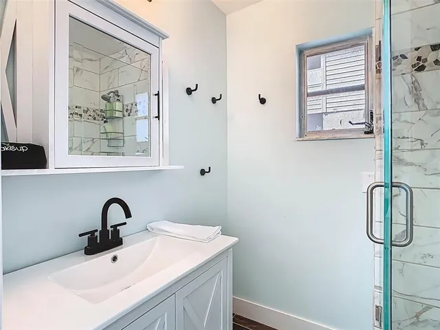 a view of a swimming pool with outdoor seating and plants