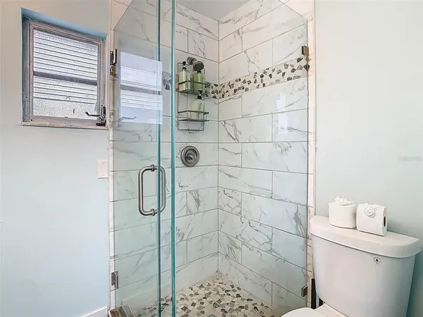 a view of a swimming pool with outdoor seating