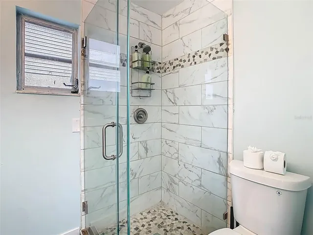 a view of a swimming pool with outdoor seating