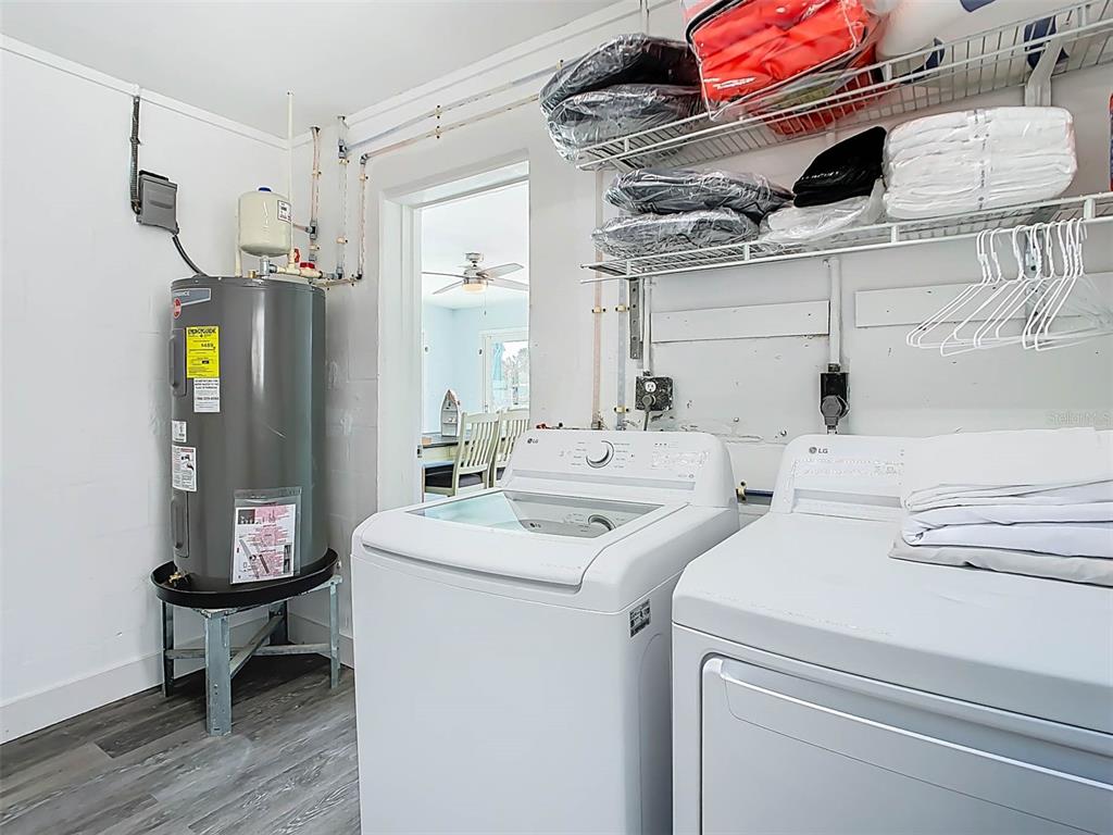 4984 Cedarbrook Lane Hernando Beach, FL 34607 - Photo 44 of 61 a utility room with dryer and washer