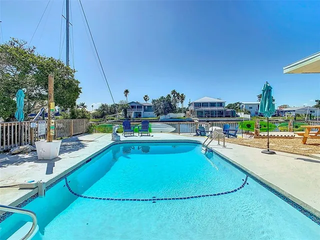 a view of a swimming pool with a lounge chairs