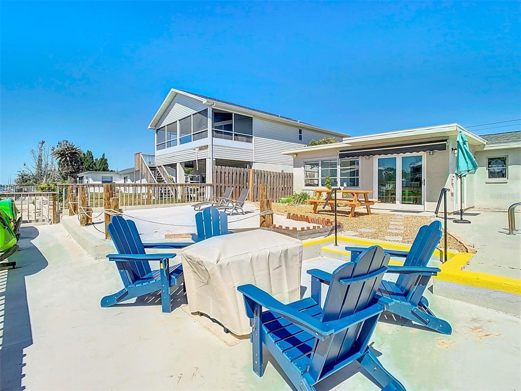 4984 Cedarbrook Lane Hernando Beach, FL 34607 - Photo 53 of 65 a view of a swimming pool with outdoor seating