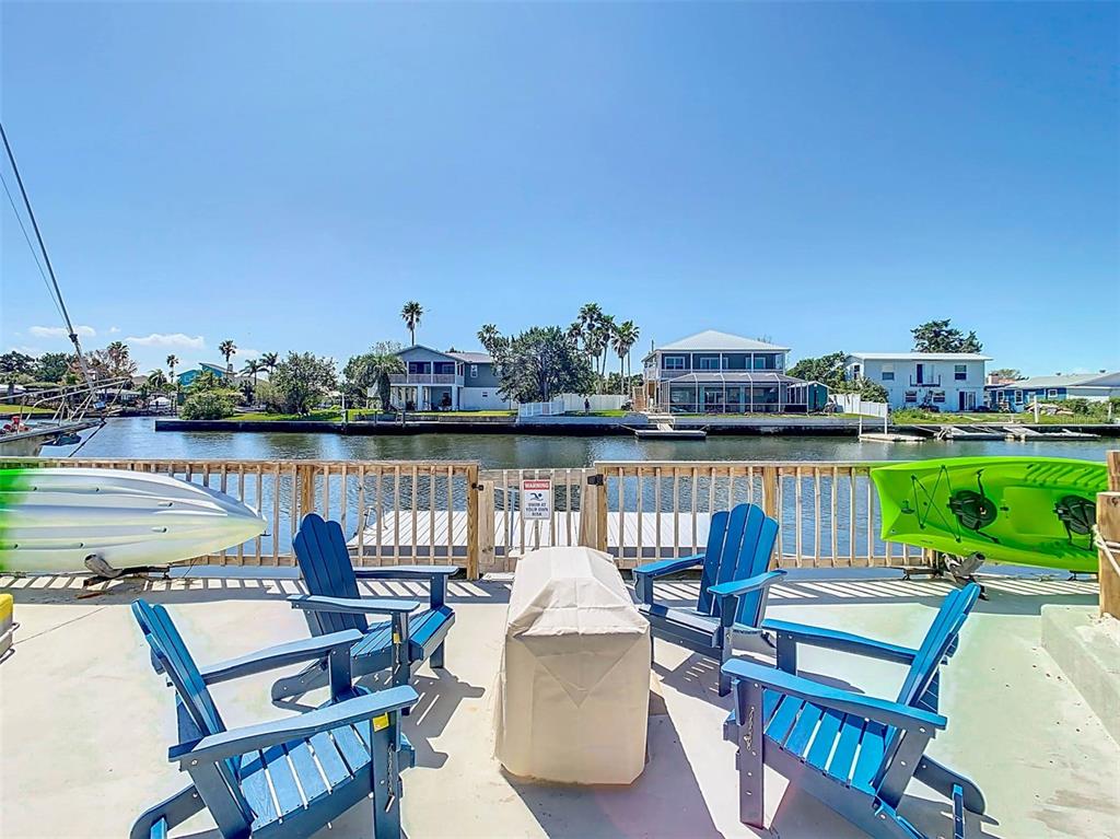 4984 Cedarbrook Lane Hernando Beach, FL 34607 - Photo 54 of 65 a terrace of a house with outdoor seating