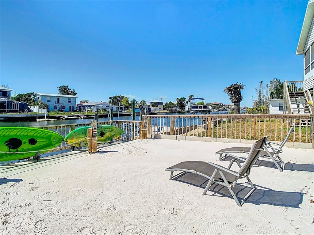 4984 Cedarbrook Lane Hernando Beach, FL 34607 - Photo 56 of 65 a view of a chairs and table in the terrace