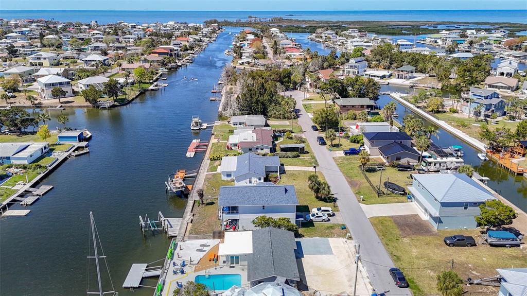 4984 Cedarbrook Lane Hernando Beach, FL 34607 - Photo 62 of 65 an aerial view of residential houses with outdoor space