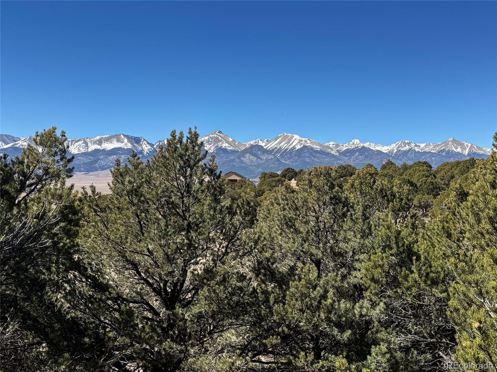 514 Kiowa Road Westcliffe, CO 81252 - Photo 27 of 27 a view of a large building with a mountain in the background