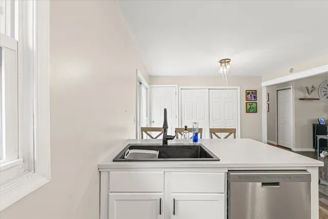 a kitchen with a stove a sink and a refrigerator