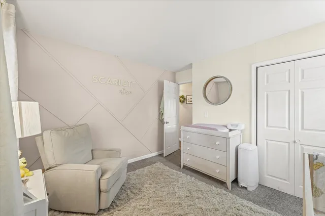 a room with a couch and a dresser