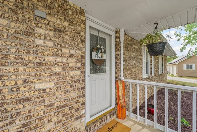 a view of balcony with furniture