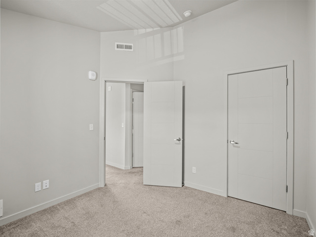 64 West 600 South, Unit C301 Springville, UT 84663 - Photo 21 of 40 Unfurnished bedroom with light carpet and baseboards