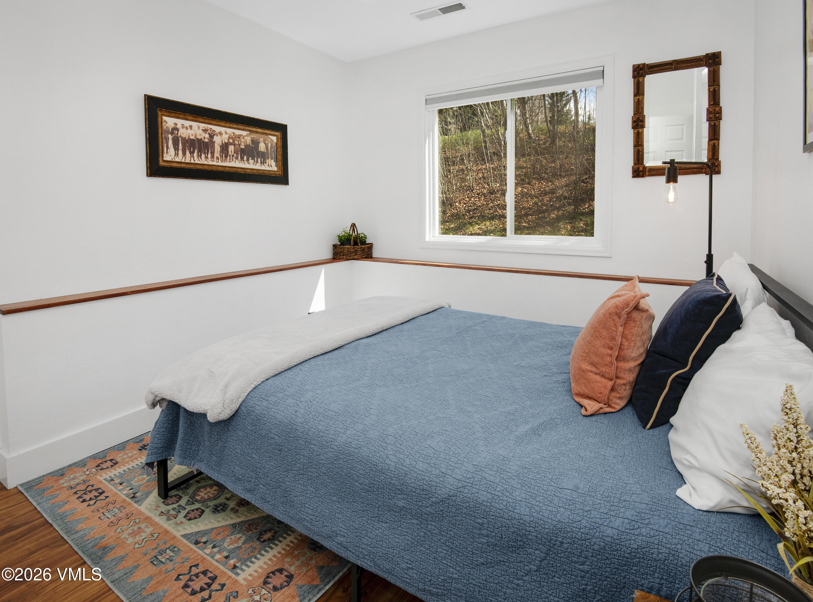 83 Arlington Place, Unit A2 Edwards, CO 81632 - Photo 14 of 19 a bedroom with a bed and a window