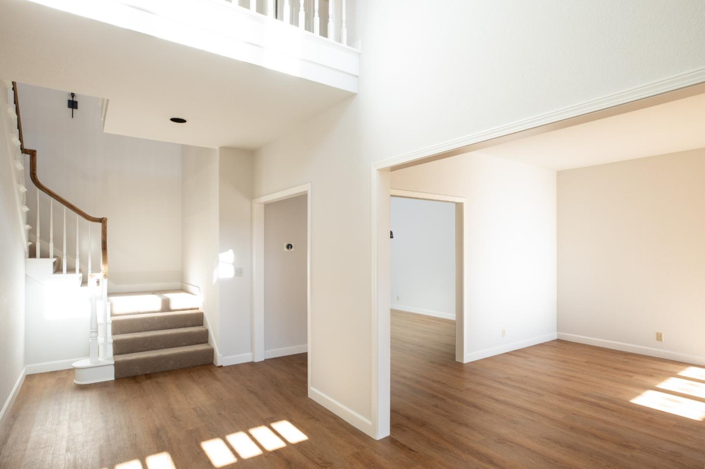 11 Fairway Place Half Moon Bay, CA 94019 - Photo 16 of 42 a view of a livingroom with wooden floor and staircase