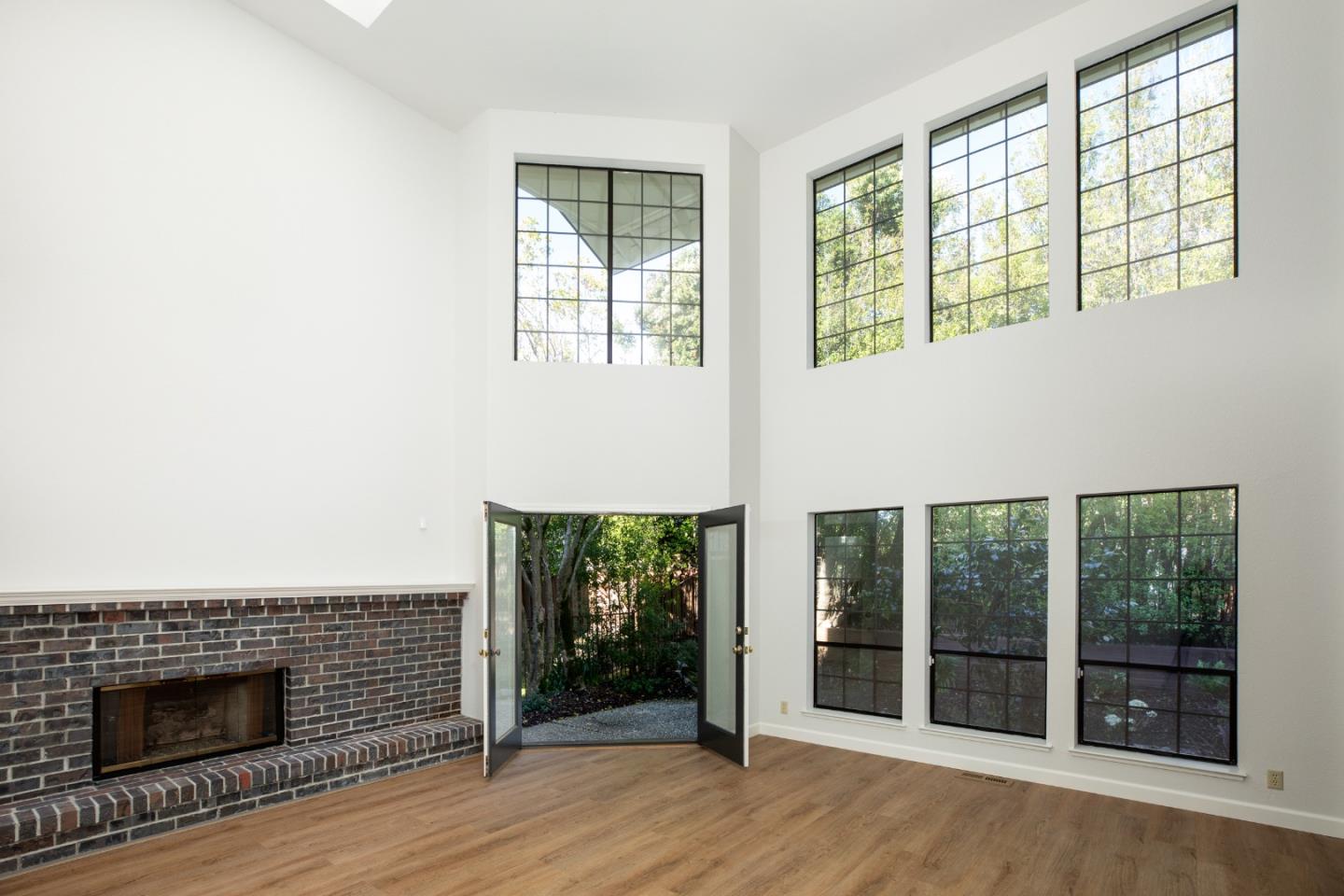 11 Fairway Place Half Moon Bay, CA 94019 - Photo 18 of 42 a view of an empty room with wooden floor and a window
